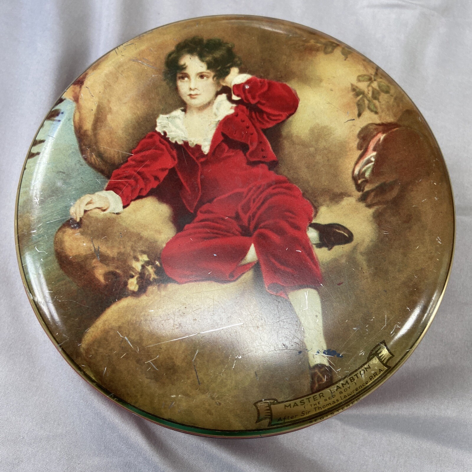 Master Lambton after Sir Thomas Lawrence Wilkin’s Red Boy Toffee Vintage Tin