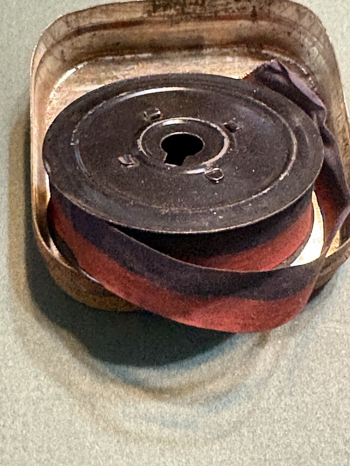 The Webster Typewriter Ribbon tin with ribbon. Early 1900s