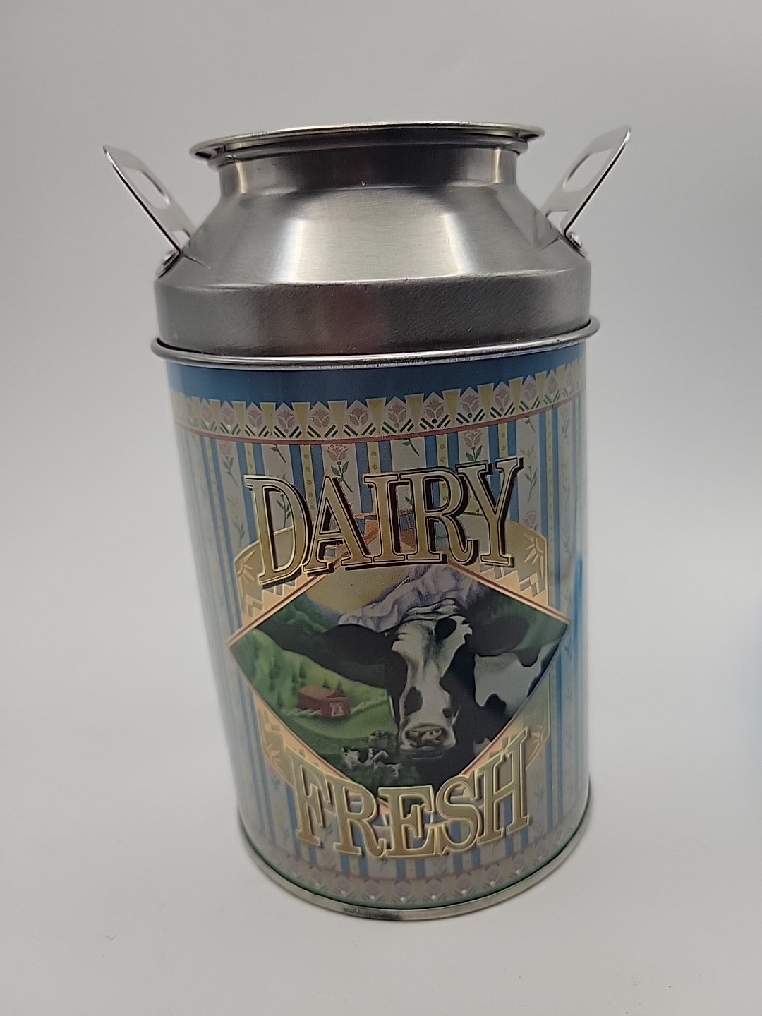 Decorative Vintage 6″ Tin Shaped Like A Milk Jug Blue With Cow “Dairy Fresh”