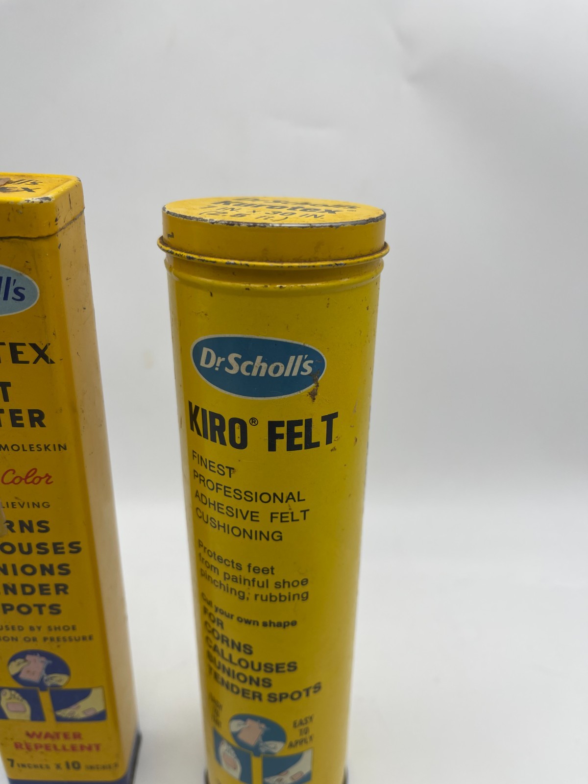 TWO Vintage Dr Scholls Empty 8″ Advertising Tins Kiro Felt & Kurotex with Lids