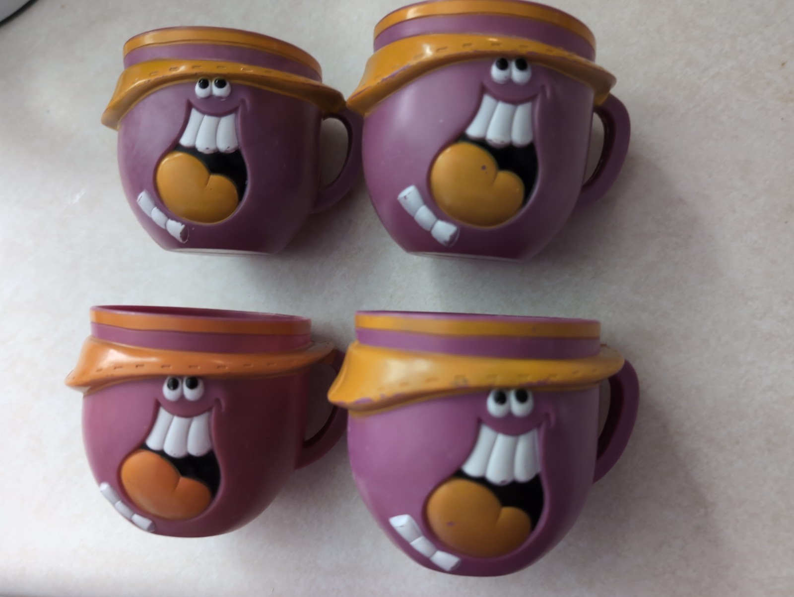 Set of 4 1970s Pillsbury Ruddi Tutti Frutti Funny Face Plastic Cup Mug Purple