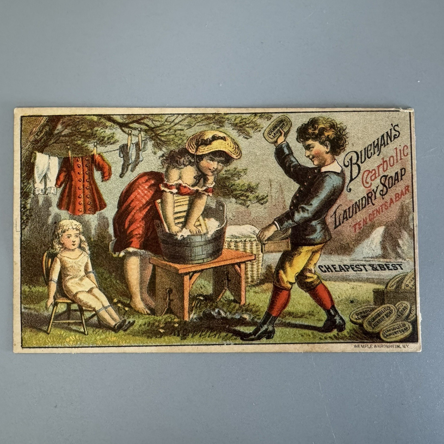 Antique Victorian Trade Card GIRL BOY WASHING DOLL CLOTHES Buchans Carbolic Soap