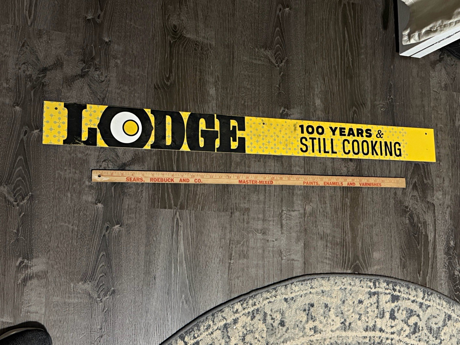 Lodge Advertising Sign “100 Years & Still Cooking” Yellow Black White