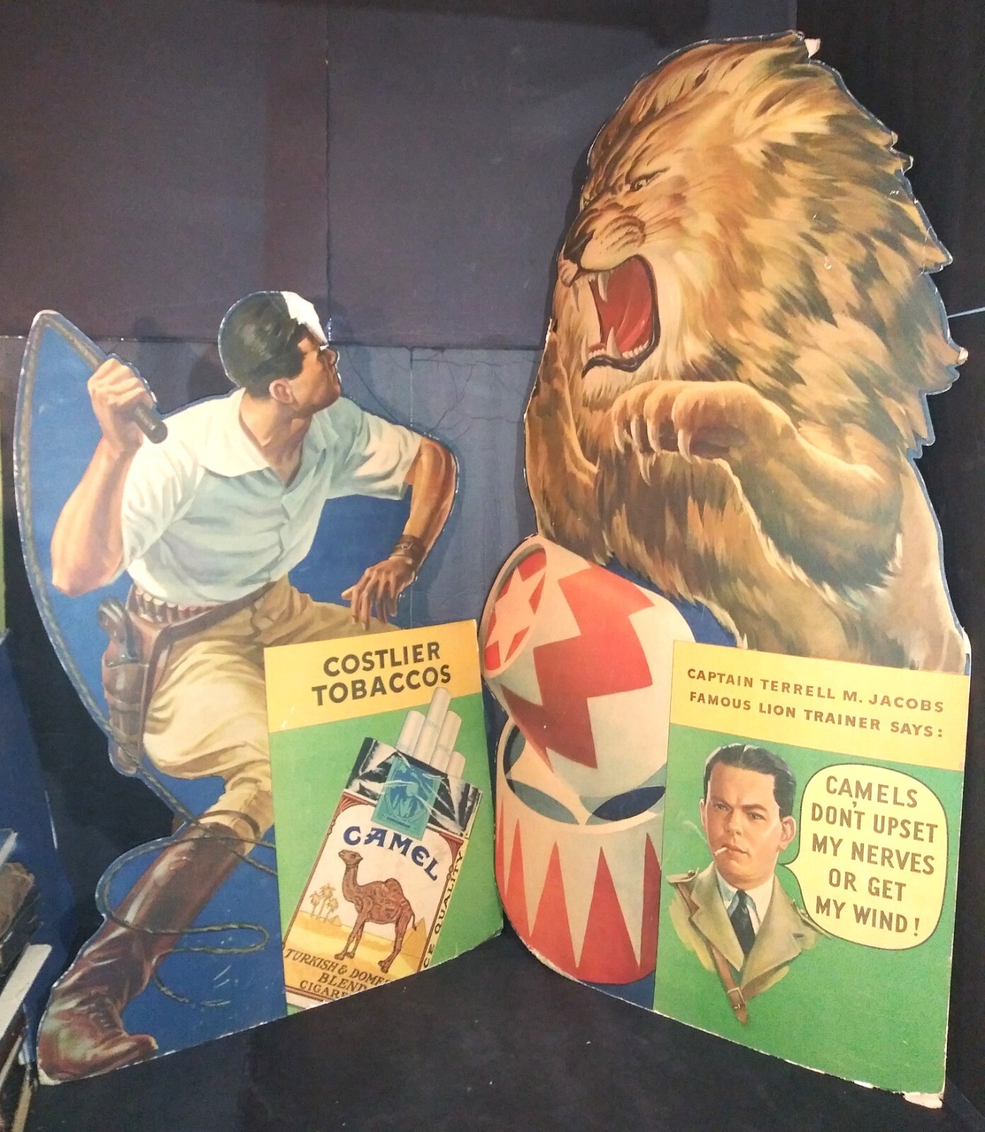 1930s DIE-CUT CARDBOARD ADVERTISING SIGNS circus lion tamer CAMEL CIGARETTES