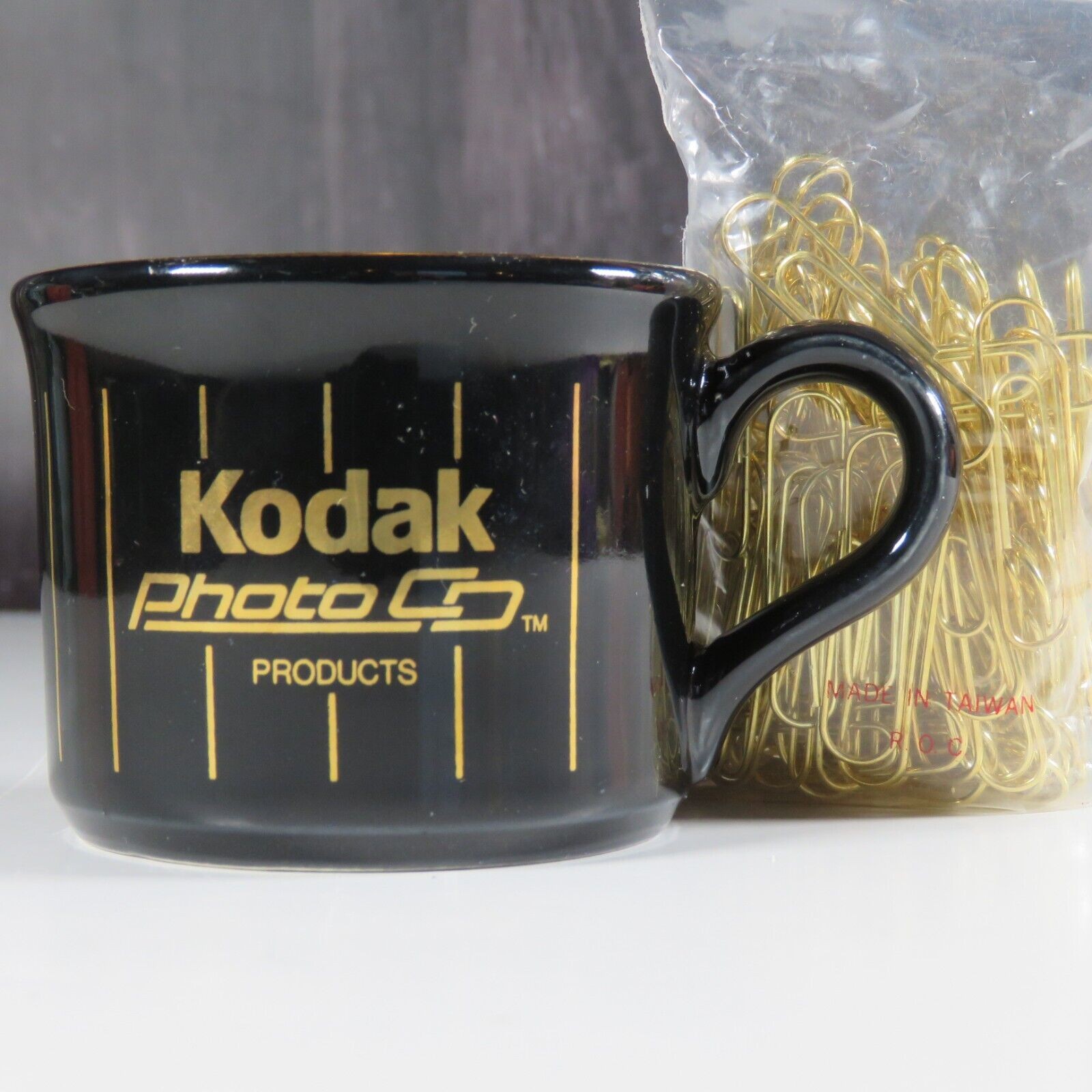 Kodak Photo Co. Paper Clip Holder Small Mug Cup Gold Black RARE Advertisement