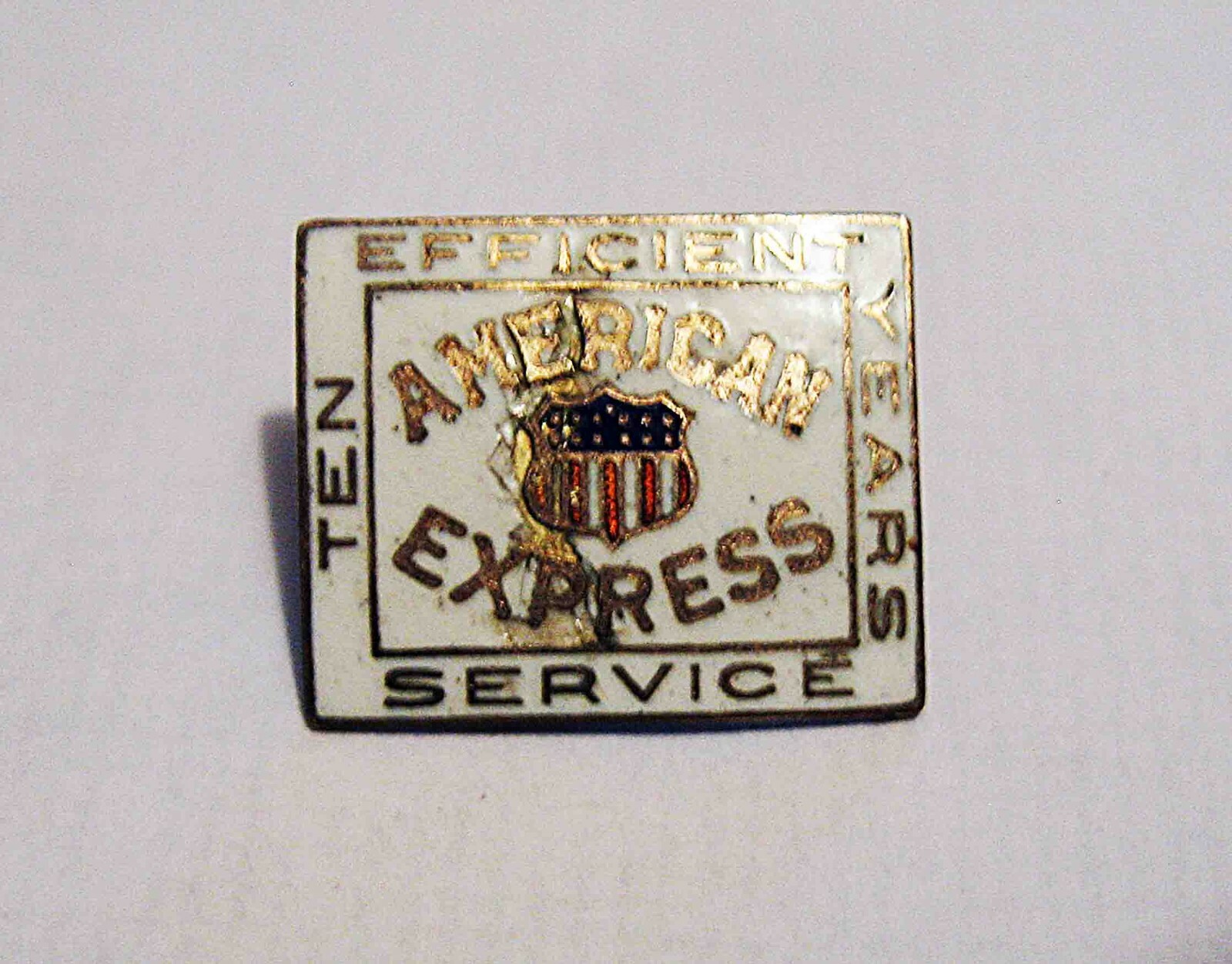 c1890-1920 AMERICAN EXPRESS “Ten Year Efficient Service” PIN/Porcelain on Copper