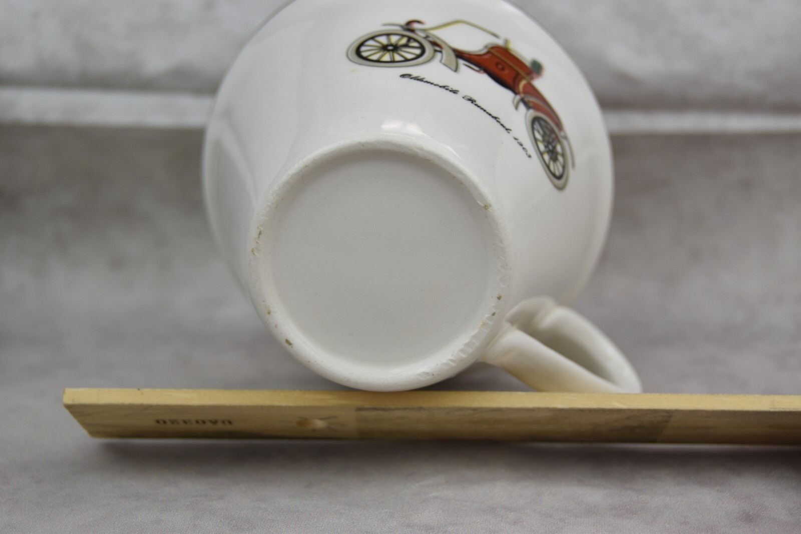 Vintage Oldsmobile Runabout red car Tea cup Gold rim small chip on the rim