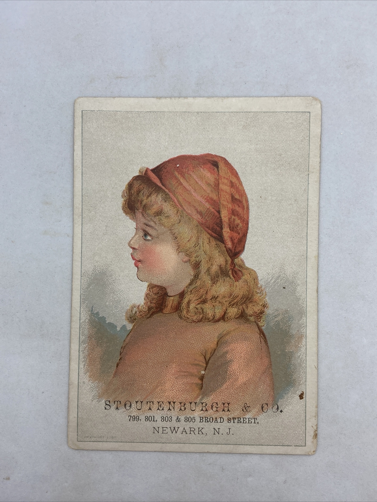 Victorian 1800’s Trade Card Stoutenburgh NEWARK Prices on Back Redhead Girl