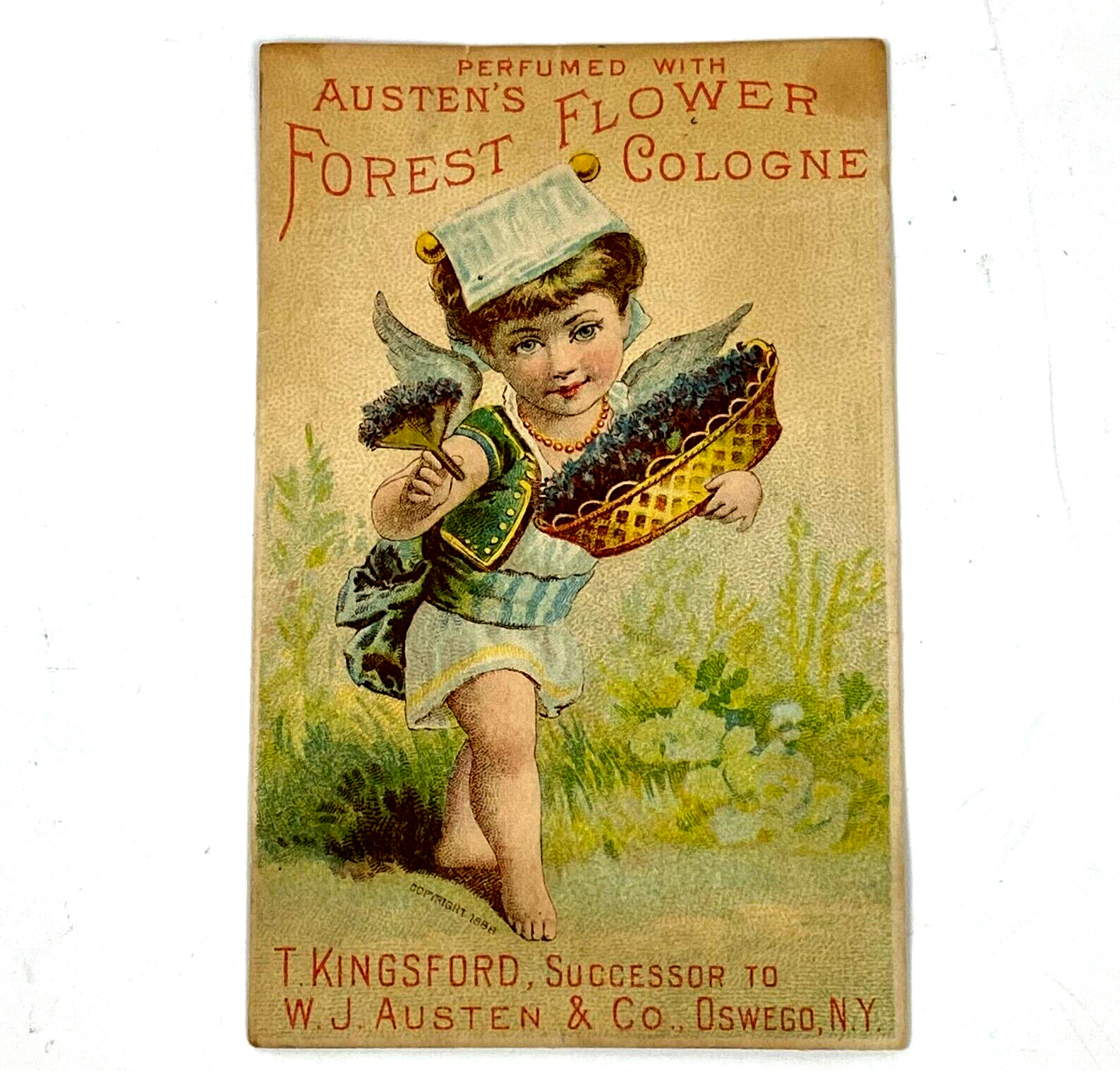 1888 Victorian Trade Card Austen’s Forest Flower Perfumes Girl Basket Oswego NY
