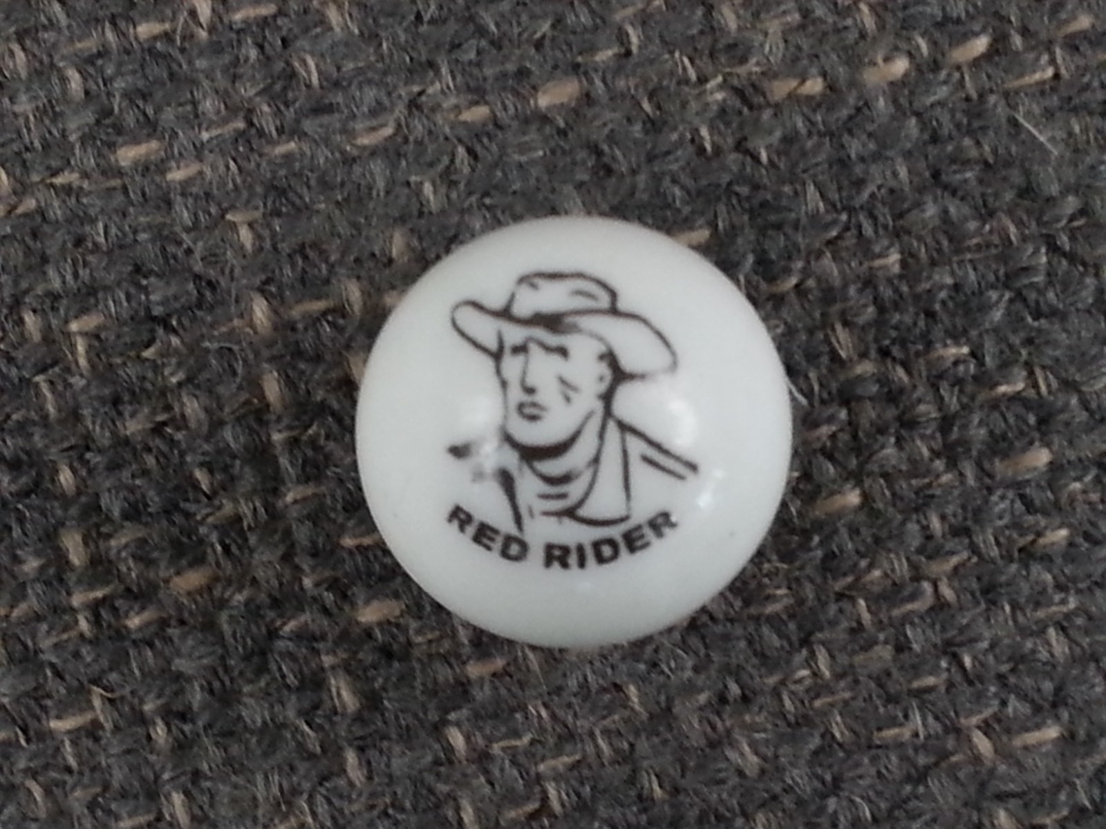 Vintage Glass Marble Advertising Red Rider Cowboy