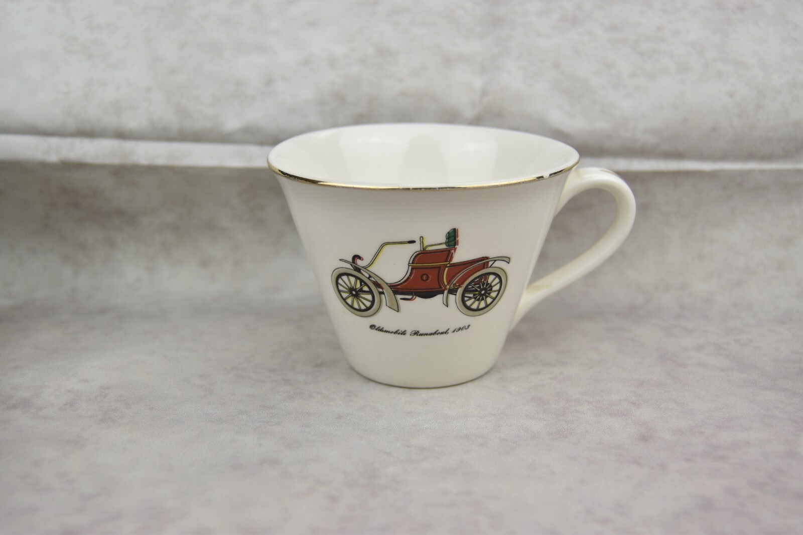 Vintage Oldsmobile Runabout red car Tea cup Gold rim small chip on the rim