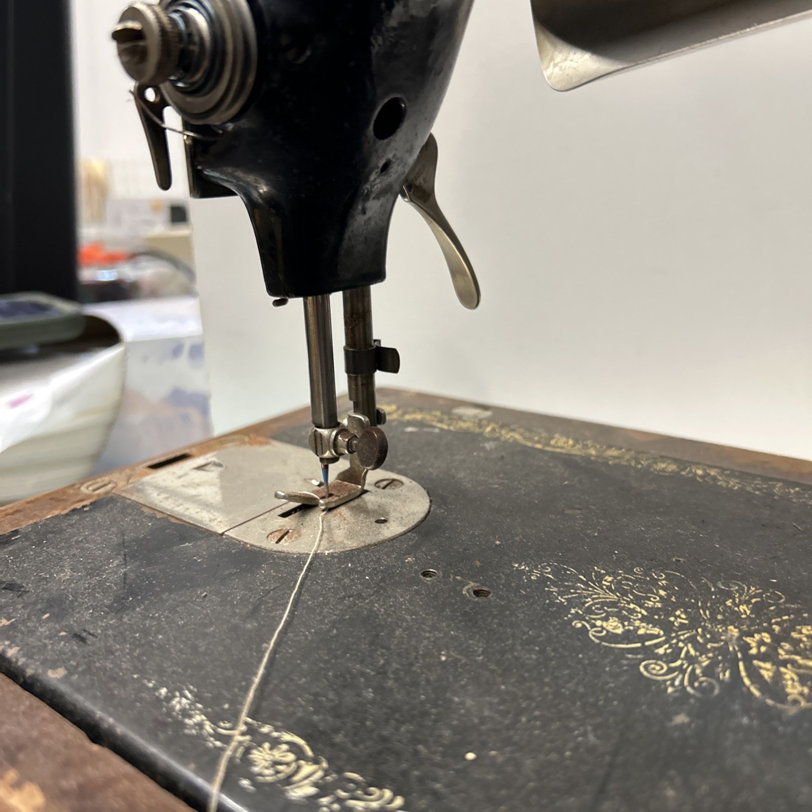 The Singer Manufacturing CoVintage Singer Sewing Machine With Light And Cabinet