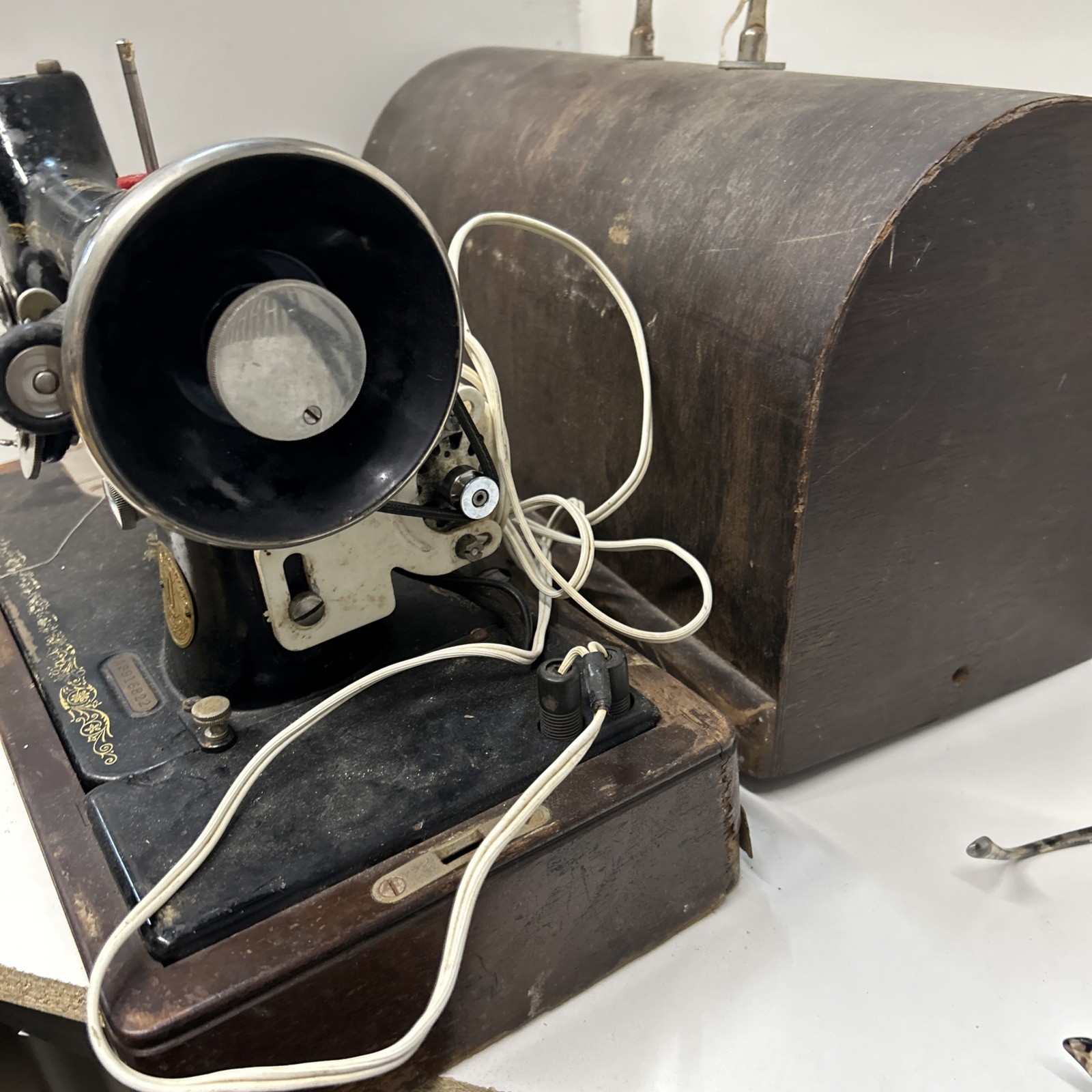 The Singer Manufacturing CoVintage Singer Sewing Machine With Light And Cabinet