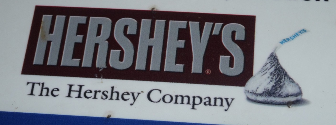 VINTAGE ANTIQUE ORIGINAL THE HERSHEY COMPANY +HERSHEYS KISS 14″ X 10″ METAL SIGN