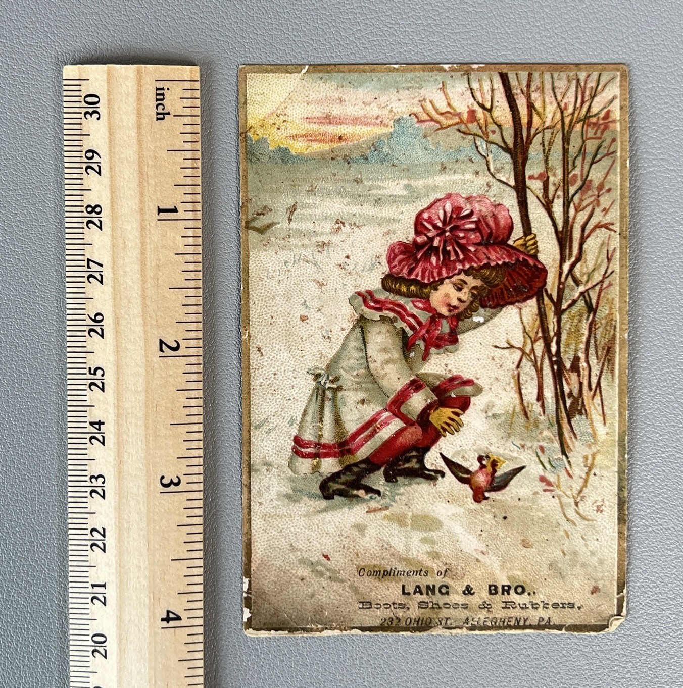 Victorian Trade Card Lang & Bro Boots Shoes Allegheny PA Girl Red Bonnet Bird