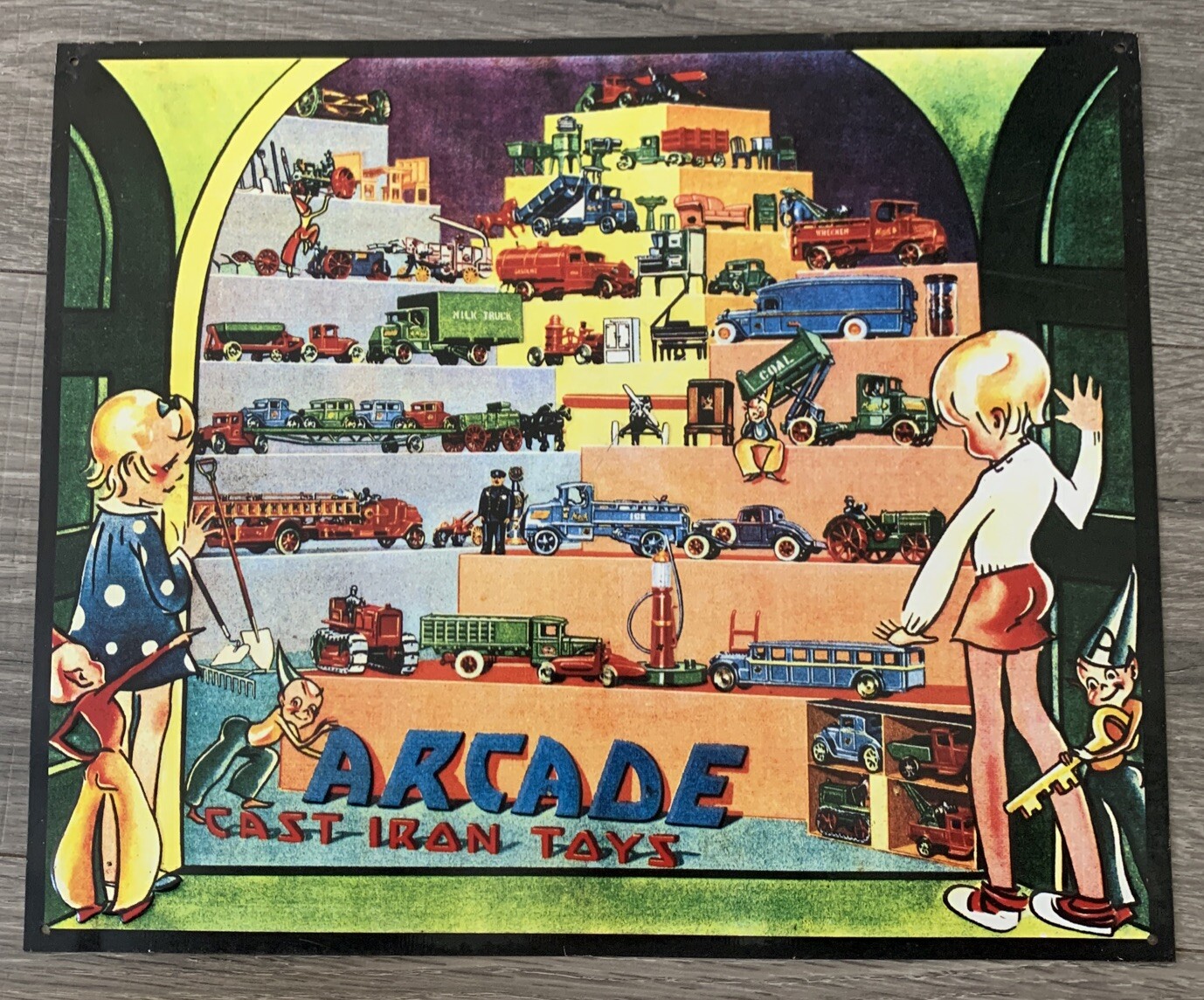 Arcade Cast Iron Toys Embossed Metal Sign 14×11 1/2″”
