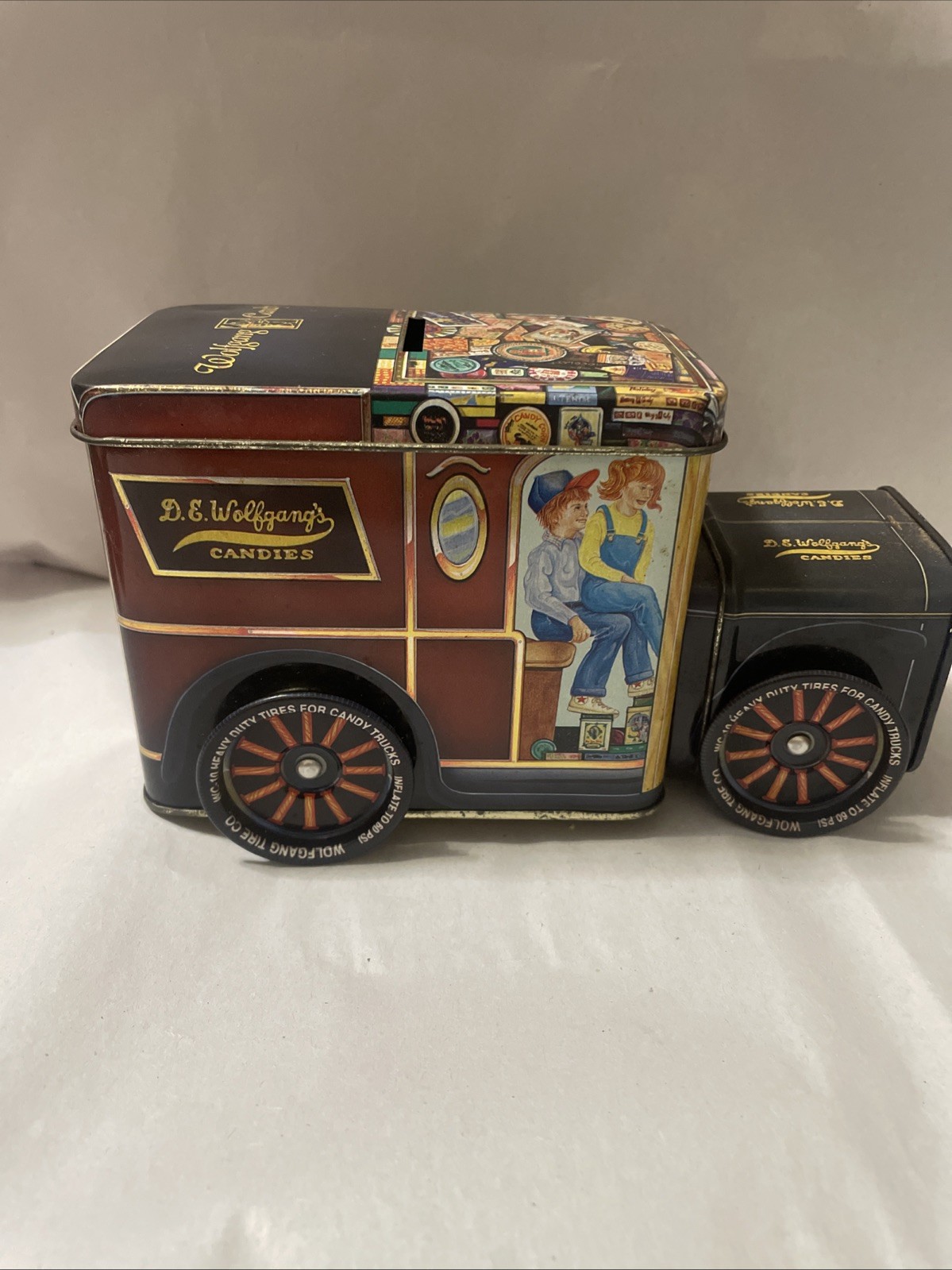 Vintage Wolfgang’s Candy Tin With Wheels and Bank Slot Front Is Removeable Empty