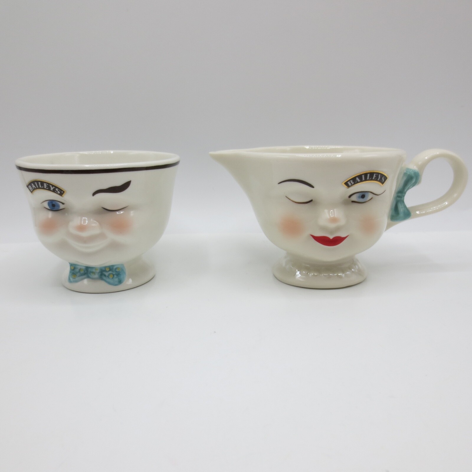 2 Bailey’s 1996 Irish Cream Winking Face Yum Sugar Bowl Cup Blue Bow Tie Lot