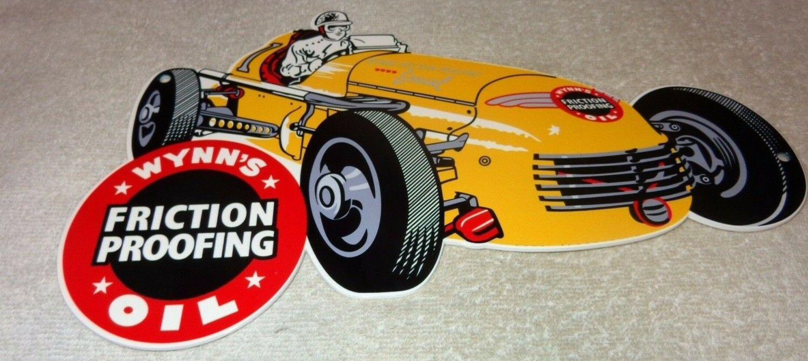 VINTAGE WYNN’S FRICTION PROOFING OIL ADDITIVE 12″ ENAMEL METAL GASOLINE CAR SIGN