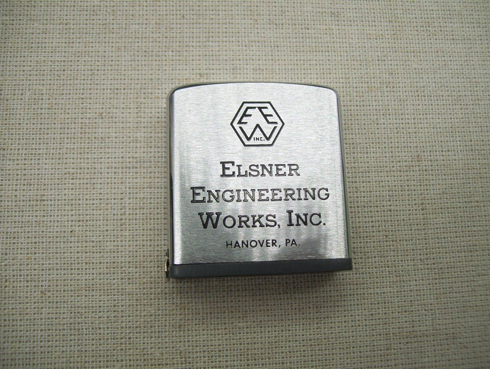 Vintage Elsner Engineering Works Hanover Zippo Advertising Pocket Tape Measure