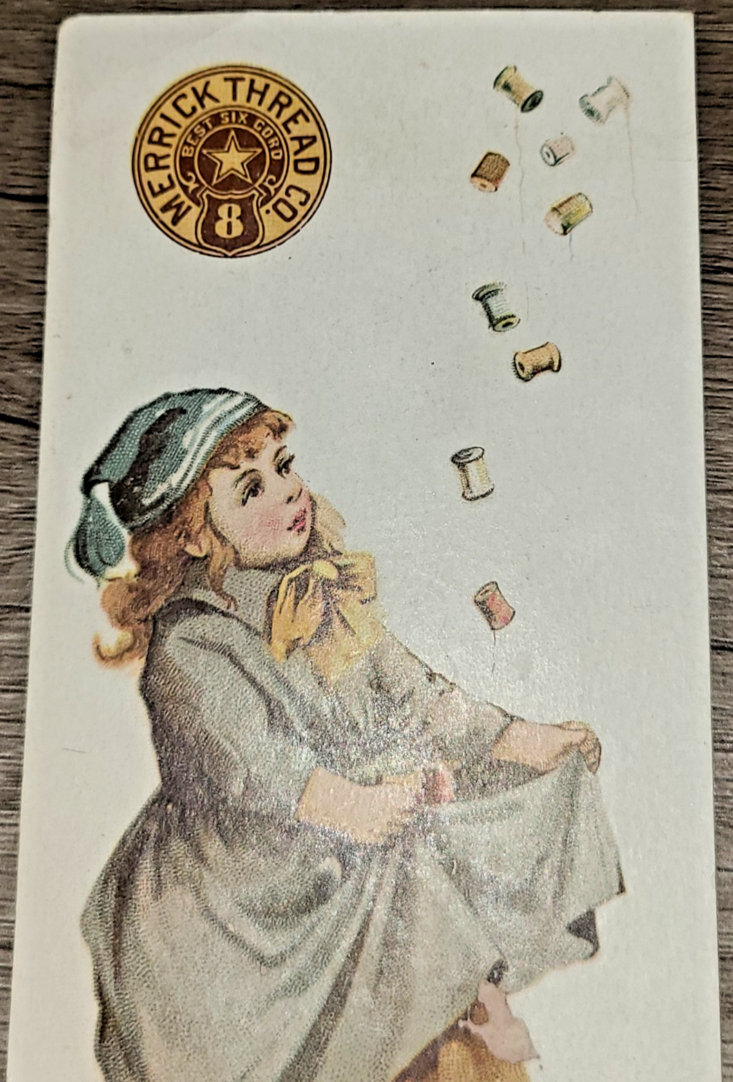 Antique Merrick Thread Co. Victorian trade card, little girl catching spools