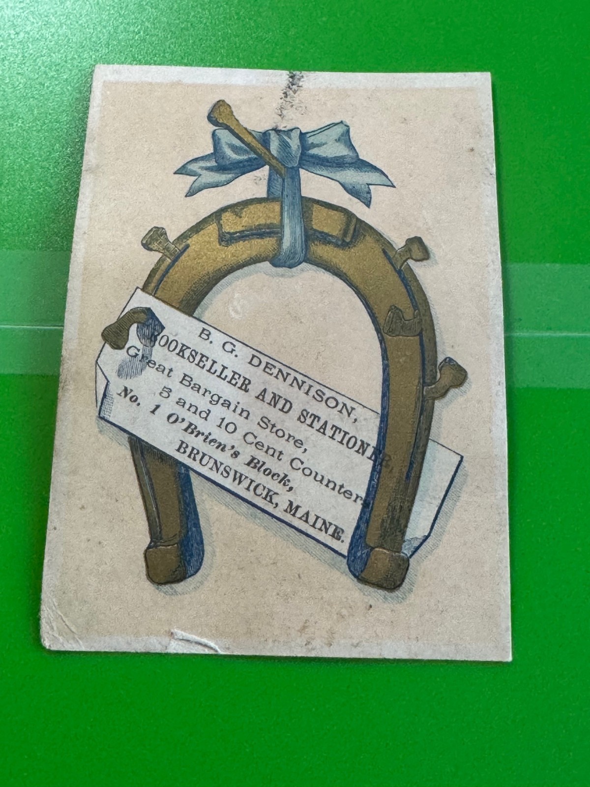E-084 Victorian Trade Card – B.G. Dennison Bookseller – Horseshoe Design
