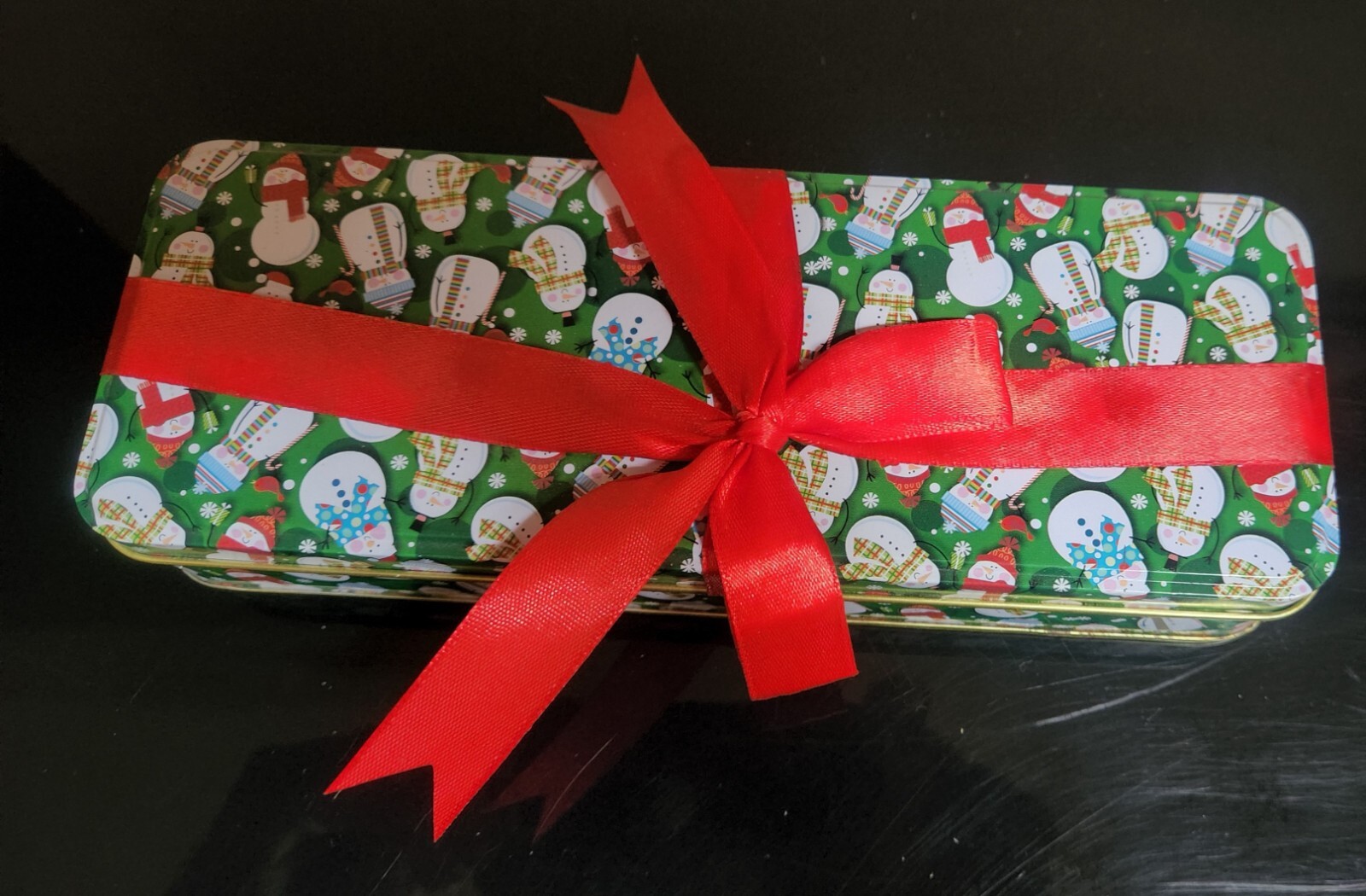 Snowman & Snowflake Christmas Tin with Red Bow; 9″x3.25″; 1.8″ Depth