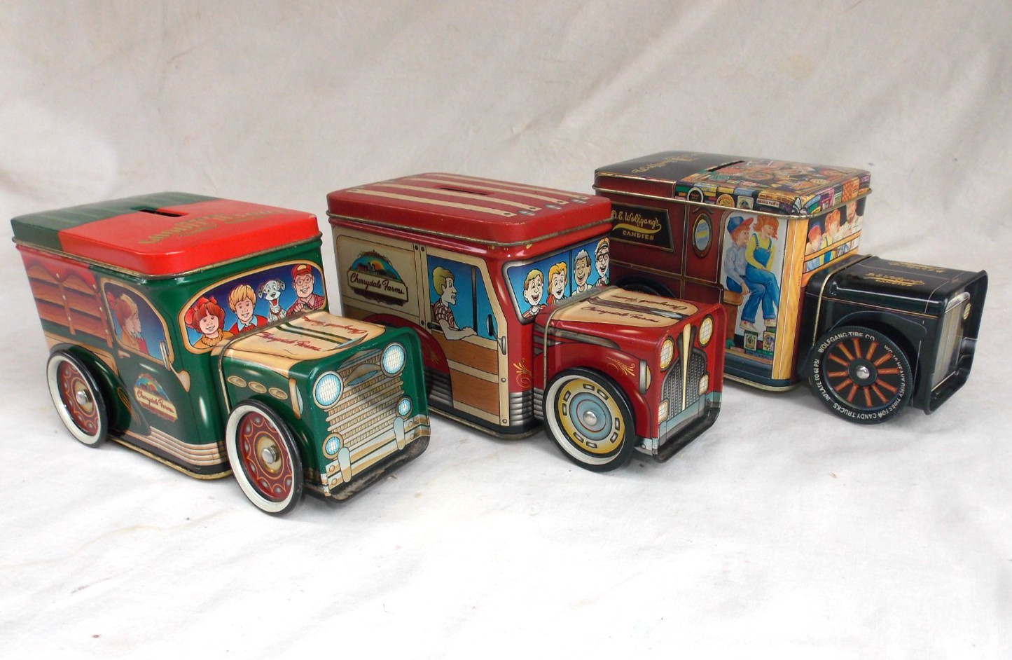 Rolling Bundle of (3) Tin Coin Banks, Cherrydale Farms, DE Wolfgang’s Candies