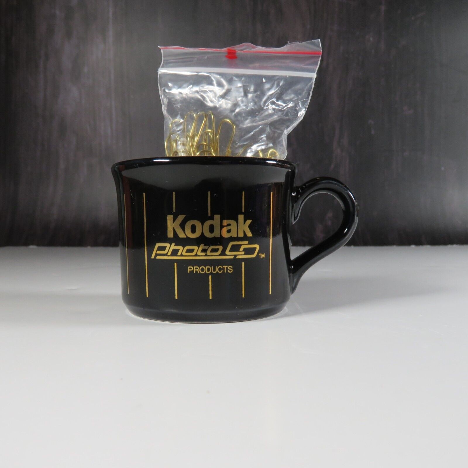 Kodak Photo Co. Paper Clip Holder Small Mug Cup Gold Black RARE Advertisement