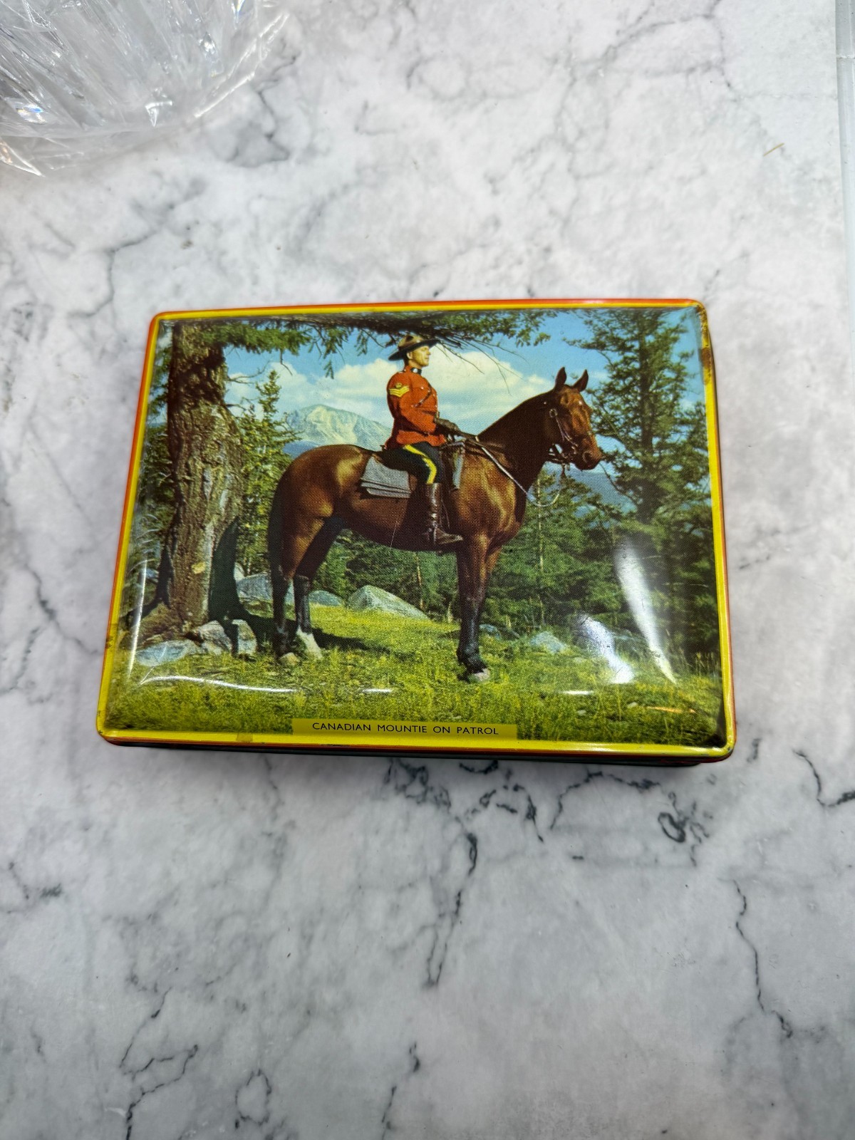 Canadian Mountie Color Photo on Tin Can Box from Riley’s Toffee Vintage