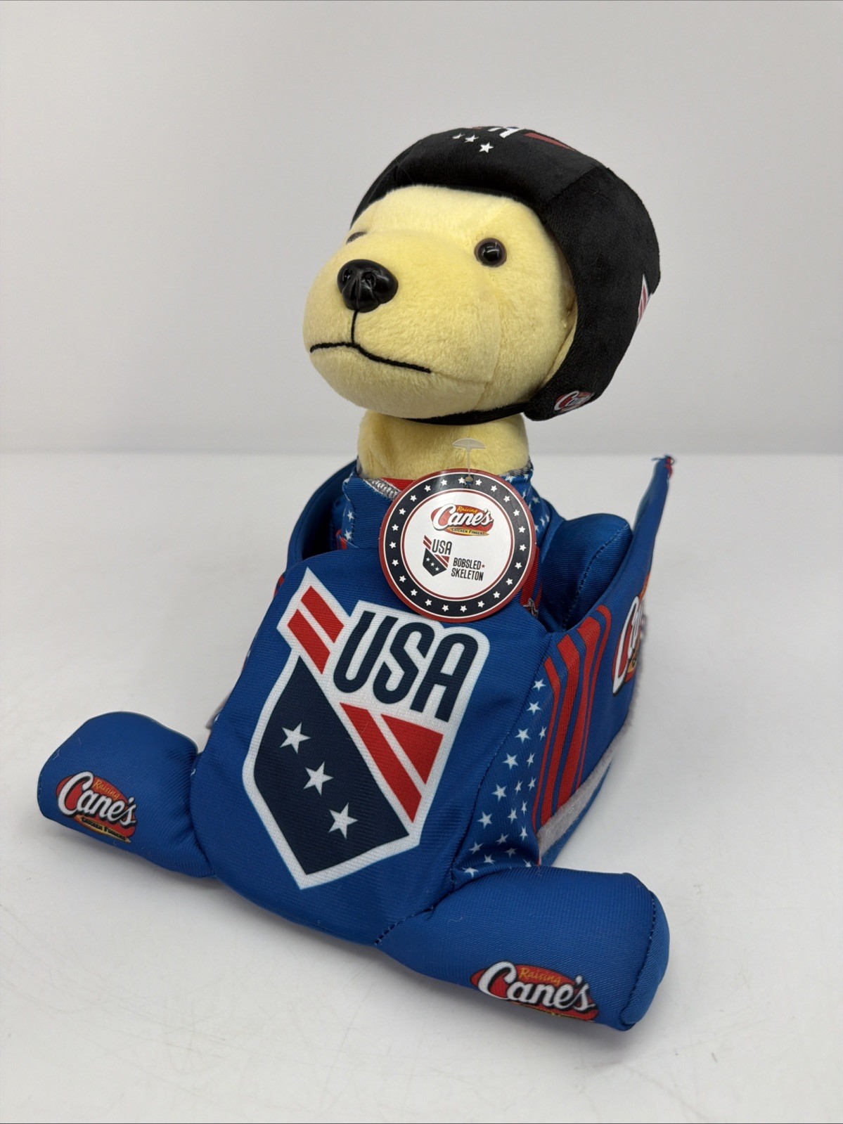 RAISING CANES 2026 LIMITED EDITION PLUSH PUPPY DOG USA BOBSLED SKELETON SEALED !