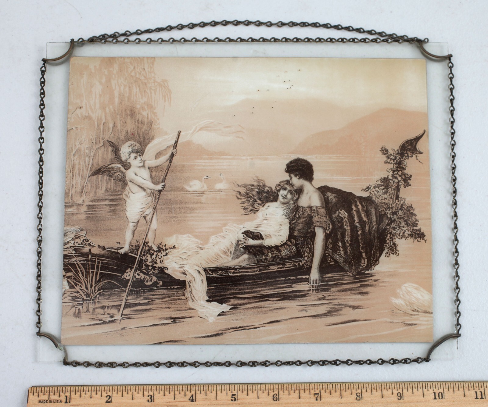 Vintage Chain Frame Ad Litho Cupid Steers the Boat Clothier Pueblo Colorado