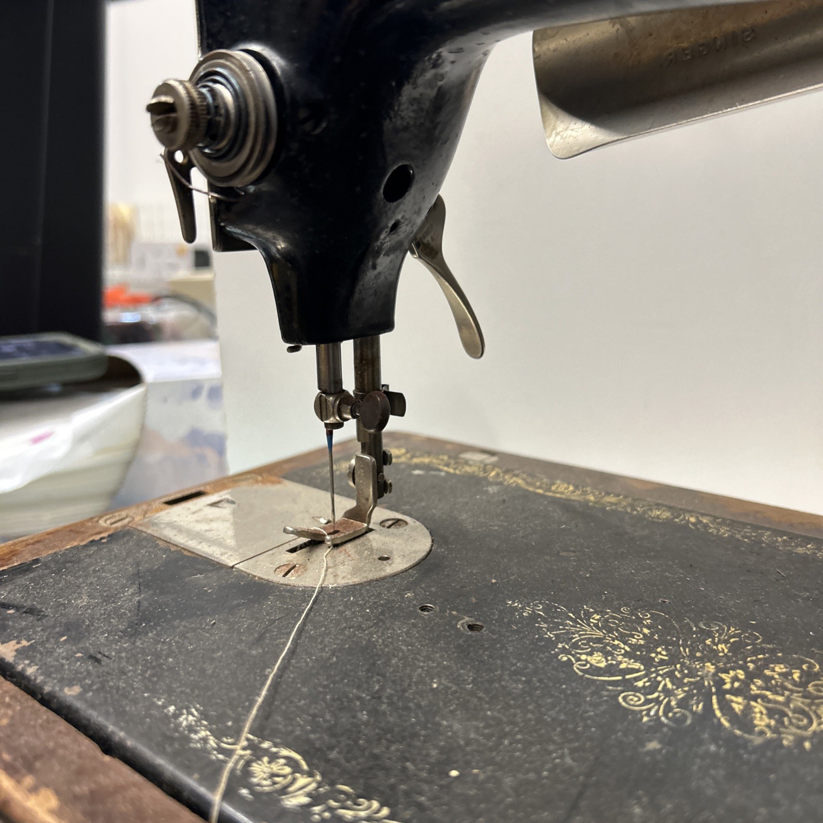 The Singer Manufacturing CoVintage Singer Sewing Machine With Light And Cabinet