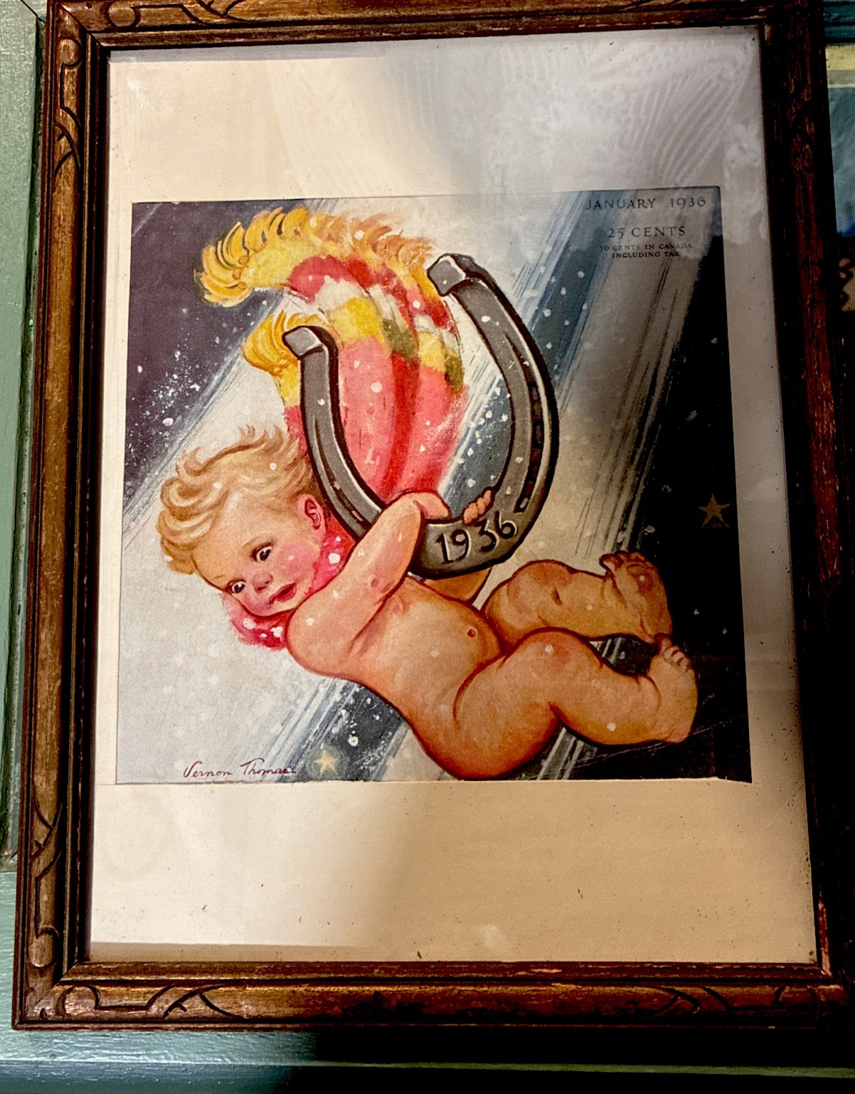 Vintage framed print of Baby New Year with a horseshoe dated 1936.